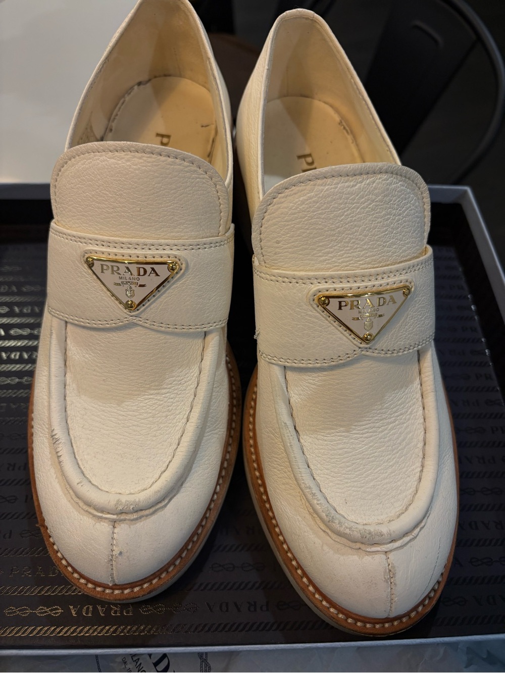 Prada Cream Leather Penny Loafers with Gold Triangle Logo